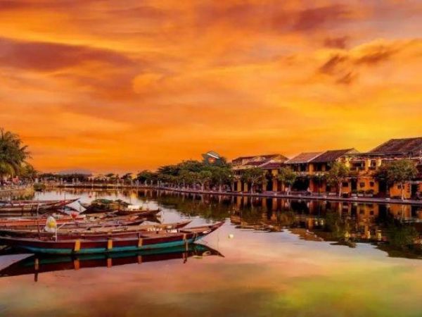 Enjoy a sunset walk by the riverside in Hoi An
